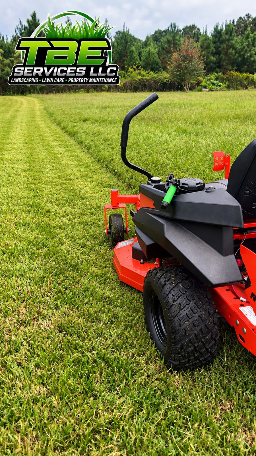 TBE Services zero-turn mower on a freshly striped lawn